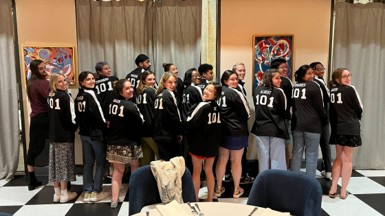 Group posing in matching jackets
