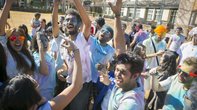 Crowd celebrating colored with paints