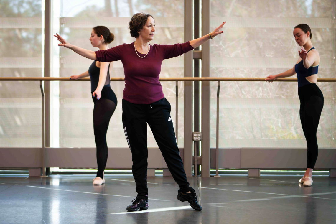 Graciela Kozak demonstrates ballet stances to dancers