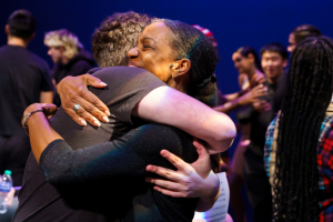 Charmaine Royal hugging student after performance