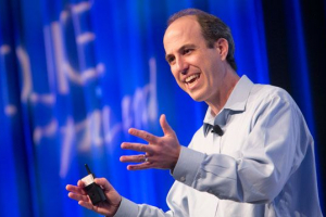 David McAdams talking on stage