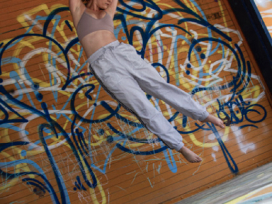 Avery Lythcott-Haims dancing against graffiti background