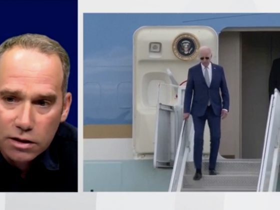 Interview with Edmund Malesky with split screen of Biden getting off plane