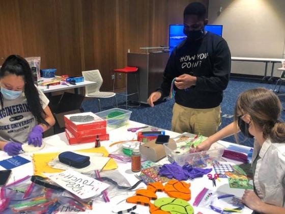 Duke students put together activity kits for Durham school children. Photo courtesy of Allie Sinclair.