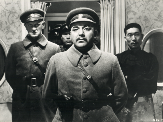 Film still showing 3 men posing in military uniform