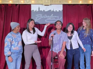 group of students doing stand-up comedy