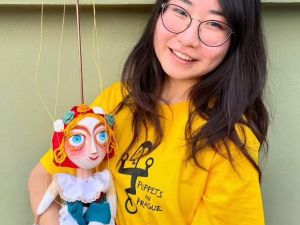 Ivy Sun holding puppet