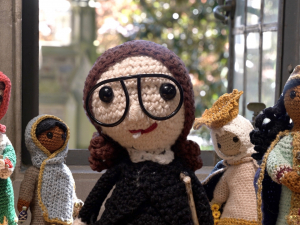 collection of crocheted dolls