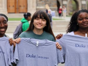 Duke Biology students hold their t-shirts after declaring their majors