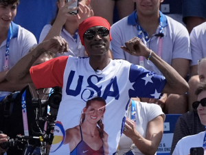 Snoop at the olympics wearing "USA" shirt