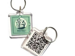 Two keychains, one showing a QR code and the other one a logo with a microscope and a DNA double helix