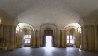 A picture of an empty room with a vaulted ceiling