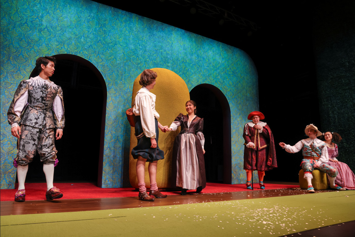 students in the liar production on stage
