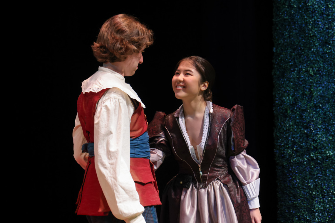 student in the liar production on stage