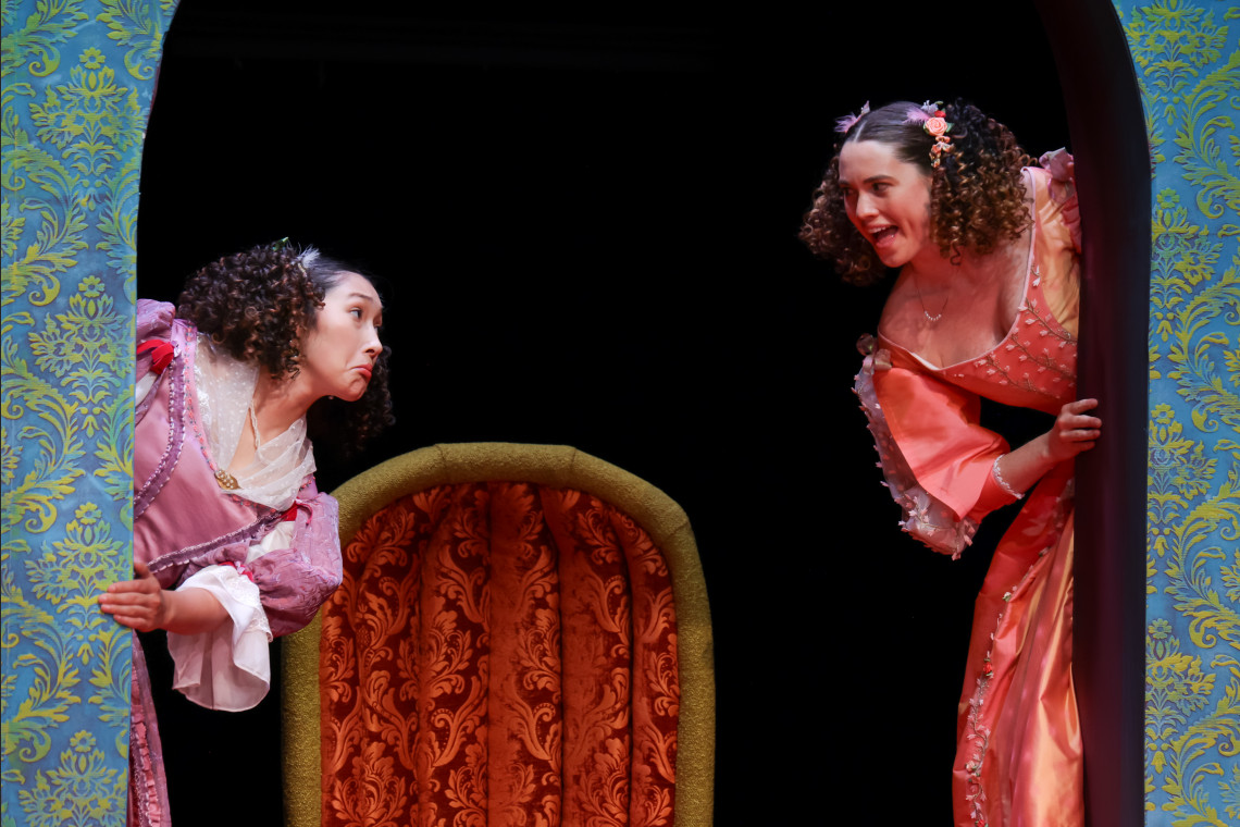 two students in the liar production on stage