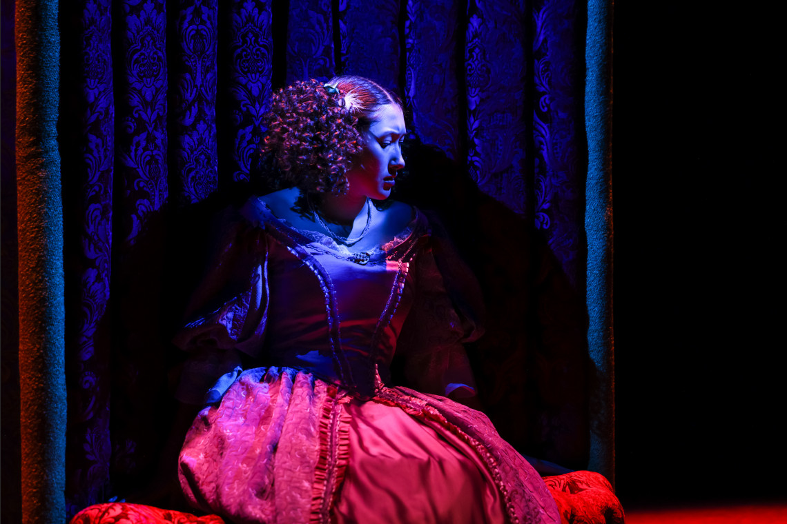 student in the liar production on stage